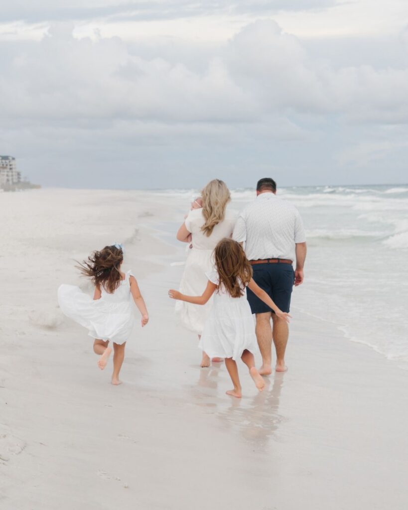 Young girls in white dresses during a Destin Florida beach family session
