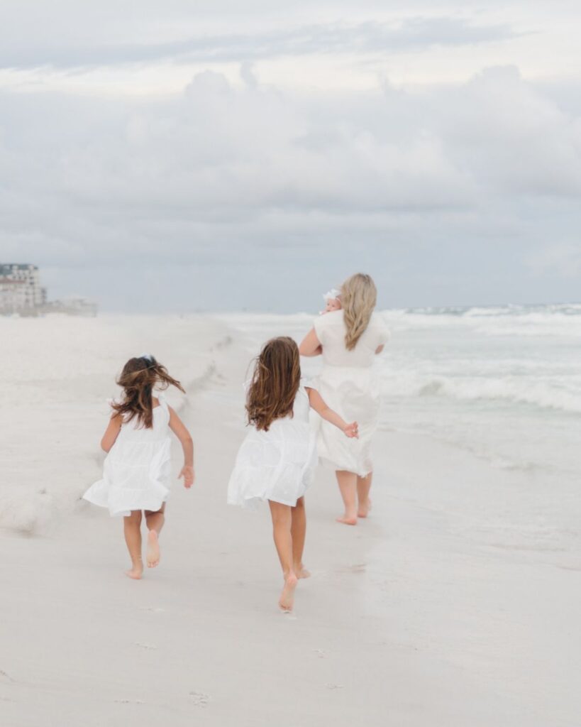 Young girls in white dresses during a Destin Florida beach family session