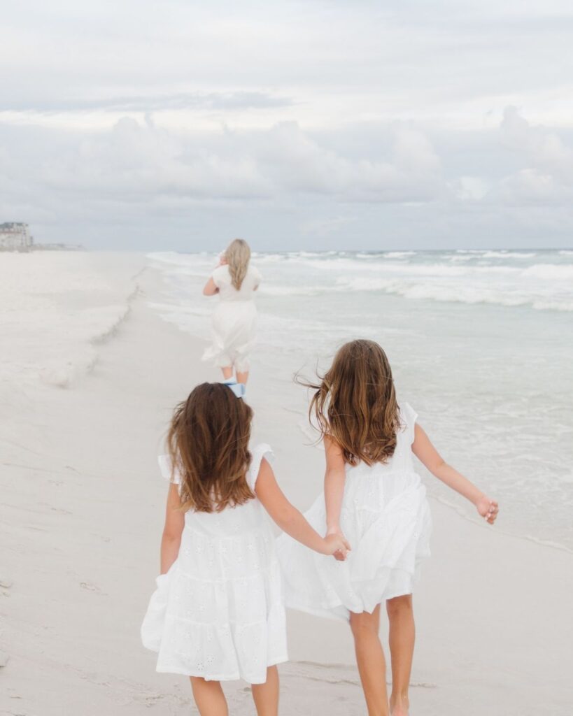 Young girls in white dresses during a Destin Florida beach family session