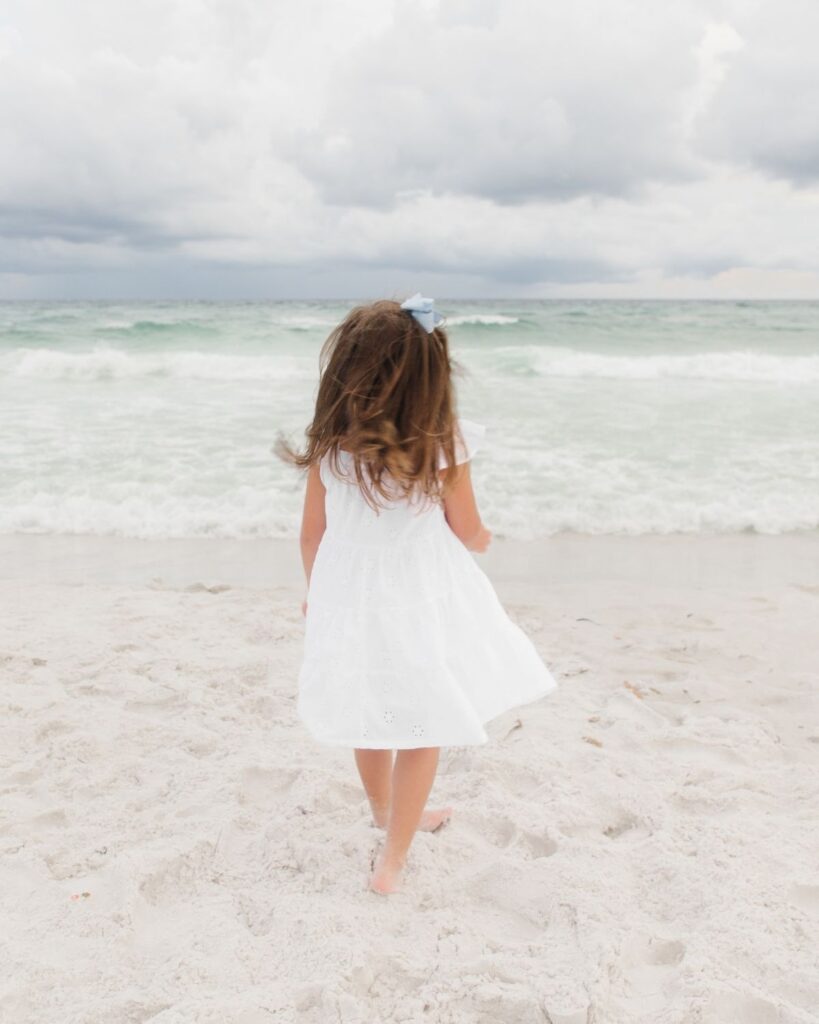 Young girls in white dresses during a Destin Florida beach family session