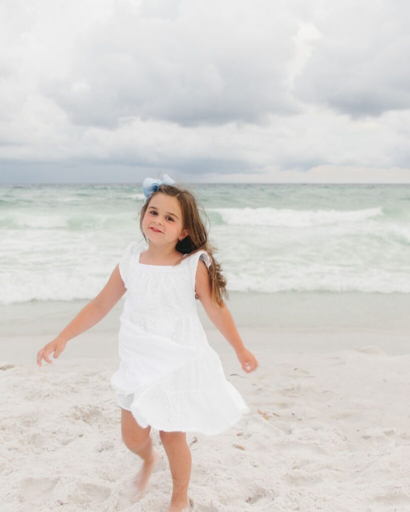 Young girls in white dresses during a Destin Florida beach family session