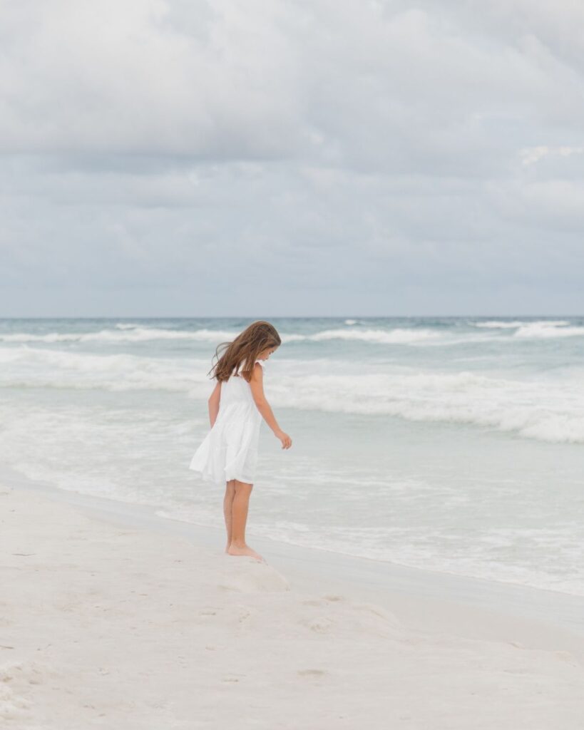 Young girls in white dresses during a Destin Florida beach family session