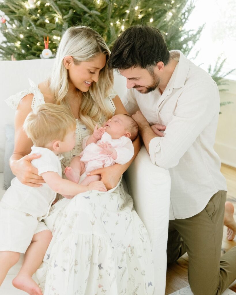 Family of four during an in-home lifestyle newborn session in Santa Rosa Beach Florida