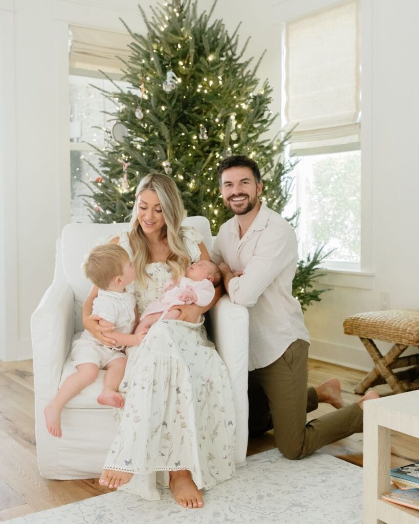 Family of four during an in-home lifestyle newborn session in Santa Rosa Beach Florida