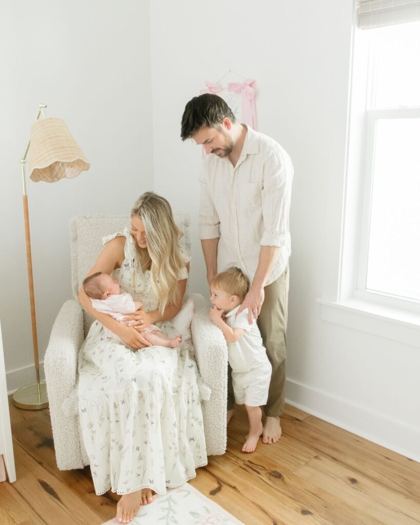 Family of four during an in-home lifestyle newborn session in Santa Rosa Beach Florida