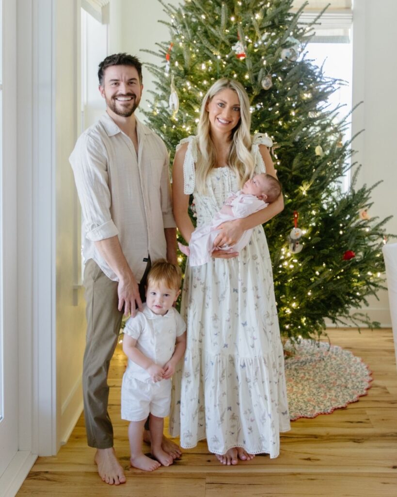 Family of four during an in-home lifestyle newborn session in Santa Rosa Beach Florida
