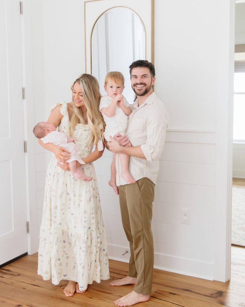 Family of four during an in-home lifestyle newborn session in Santa Rosa Beach Florida