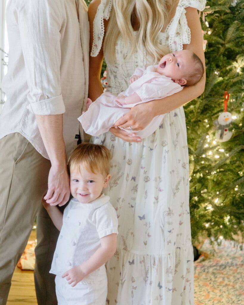 Family of four during an in-home lifestyle newborn session in Santa Rosa Beach Florida