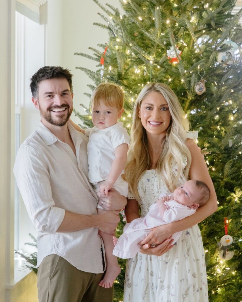 Family of four during an in-home lifestyle newborn session in Santa Rosa Beach Florida